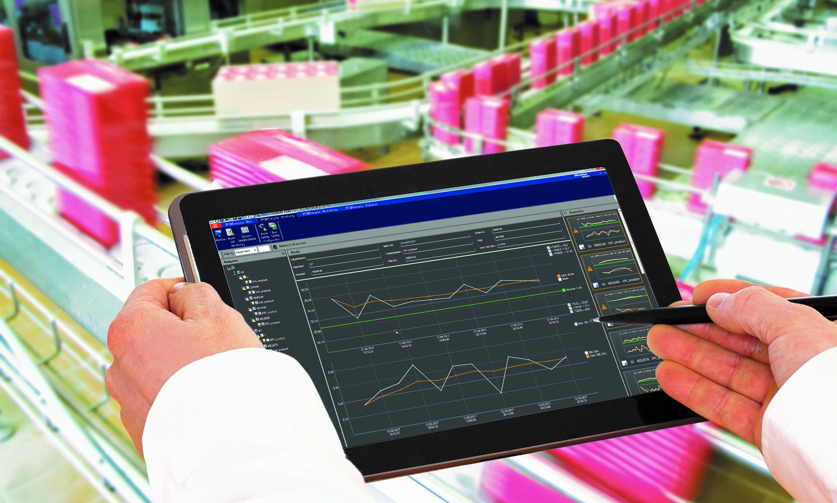 Hands holding a tablet with data image from Minebea Intec SPC@Enterprise software.