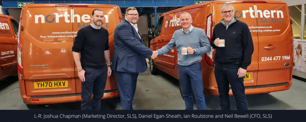 Daniel Egan-Sheath from Northern Balance shakes hands with Ian Roulstone from SLS